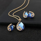 Ensemble de collier et boucles d'oreilles en cristal bleu avec doré