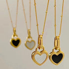 Collier avec pendentif en forme de cœur noir et blanc en or