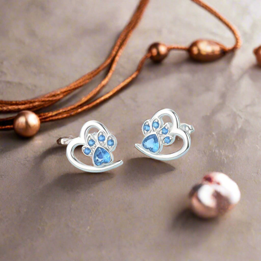 Boucles d'oreilles avec patte et cœur en zircon