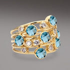 Bague vintage en or avec plusieurs zirconias bleus