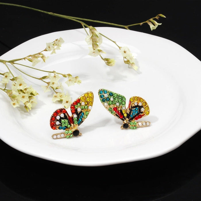 Boucles d'oreilles en forme de papillon avec des zirconiums colorés