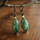Boucles d'oreilles vintage avec pierre verte