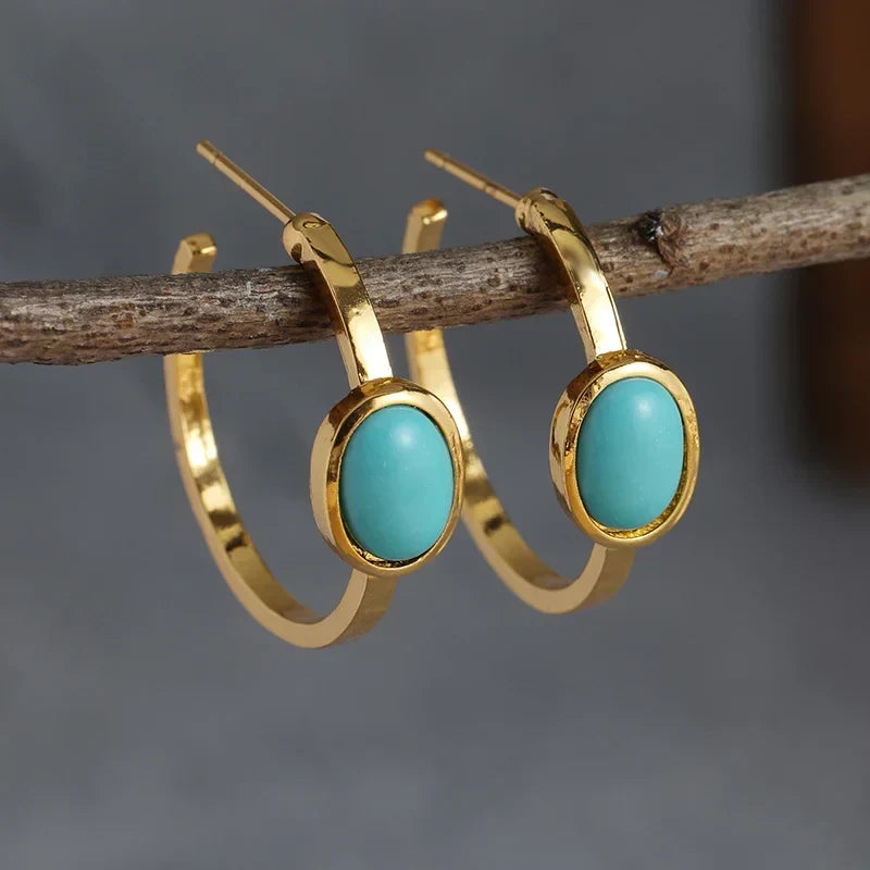 Boucles d'oreilles dorées avec pierres turquoises