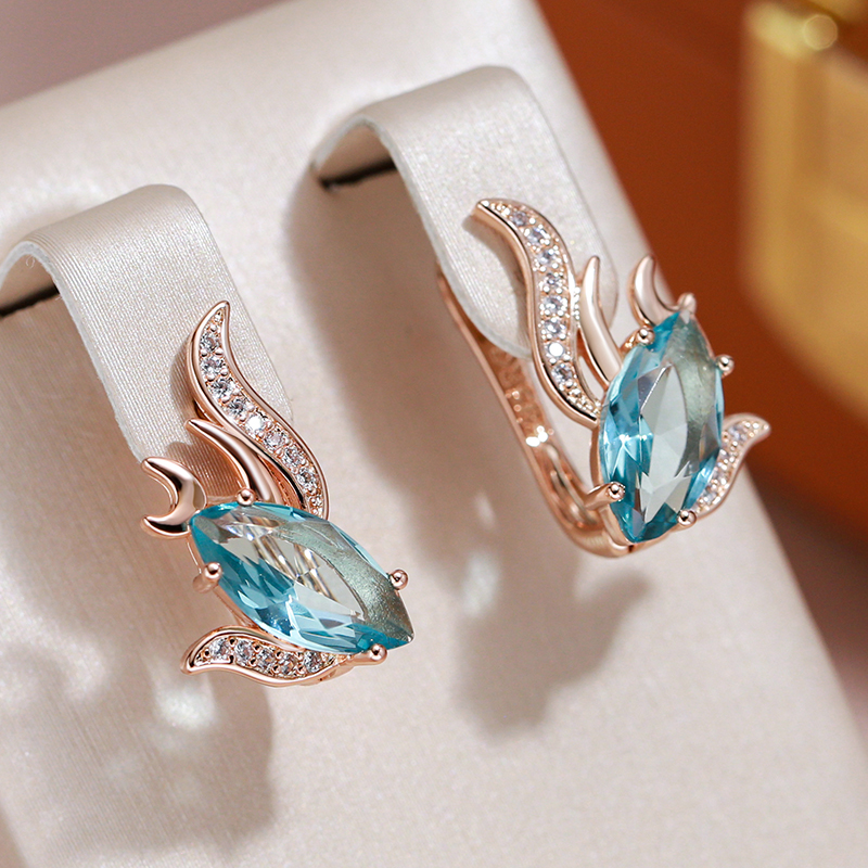 Boucles d'oreilles élégantes avec des cristaux turquoise en or