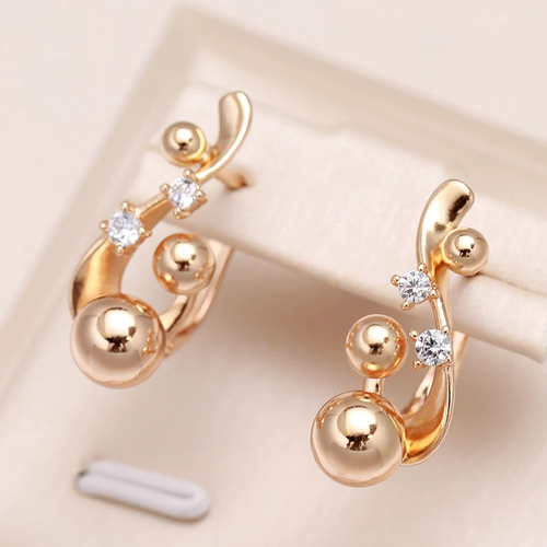 Boucles d'oreilles rondes dorées élégantes avec zircon