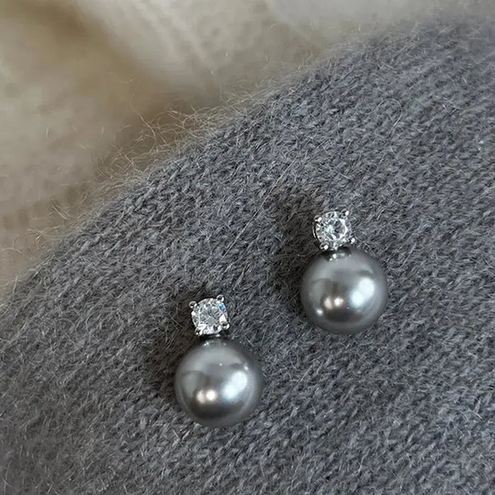 Boucles d'oreilles élégantes en perles noires avec zircon