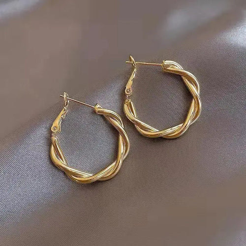 Boucles d'oreilles élégantes en or avec nœud