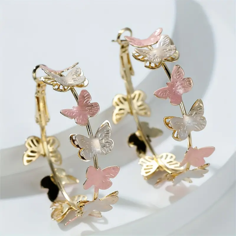Boucles d'oreilles créoles avec des papillons vintage
