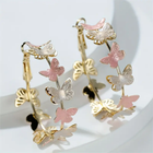 Boucles d'oreilles créoles avec des papillons vintage