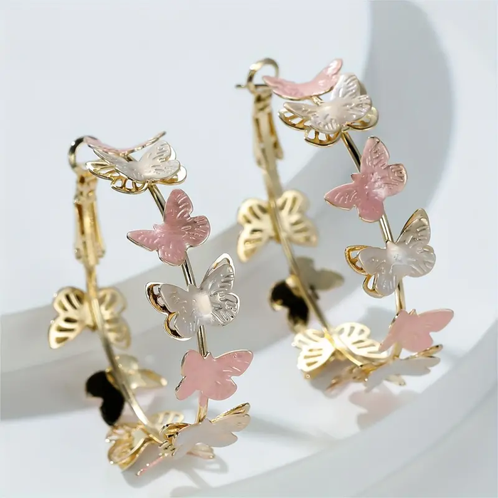 Boucles d'oreilles créoles avec des papillons vintage