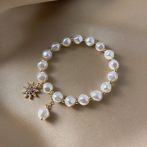 Bracelet avec pendentif en or blanc, perle et tournesol