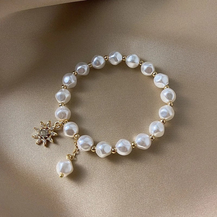 Bracelet avec pendentif en or blanc, perle et tournesol