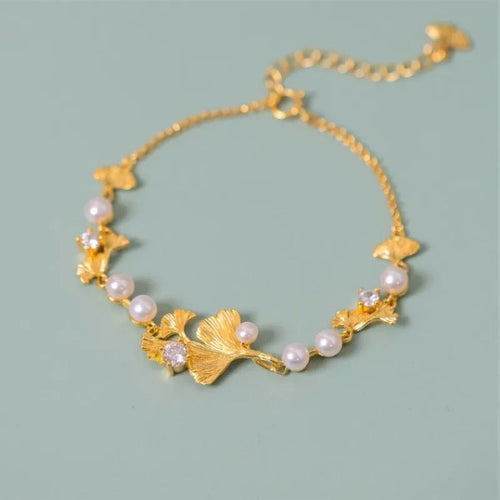 Bracelet classique en or avec des feuilles de ginkgo et des perles
