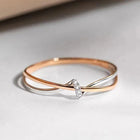 Bague entrelacée en or rose et en argent