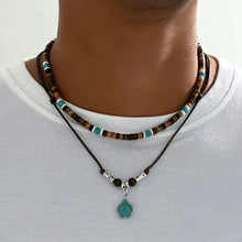 Collier de luxe pour homme avec des perles en turquoise et en œil de tigre