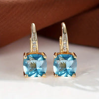 Boucles d'oreilles en anneau doré avec pierre mystique