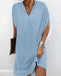 Robe élégante à manches fendues de couleur unie
