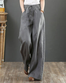 Pantalon large taille haute de couleur unie