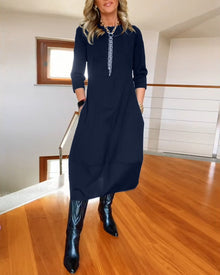 Robe élégante de couleur unie avec poche et col rond