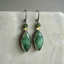 Boucles d'oreilles vintage avec pierre verte