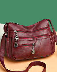 Sac bandoulière en cuir souple avec multipoches