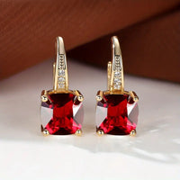 Boucles d'oreilles en anneau doré avec pierre mystique