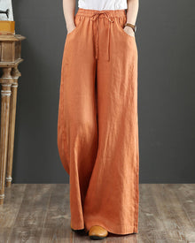 Pantalon large taille haute de couleur unie