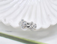 Boucles d'oreilles Étreinte de Pattes avec zirconium brillant