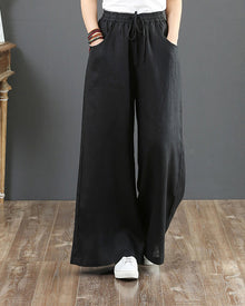 Pantalon large taille haute de couleur unie