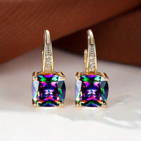 Boucles d'oreilles en anneau doré avec pierre mystique