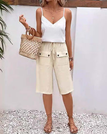 Pantalon mi-long décontracté avec poche de couleur unie