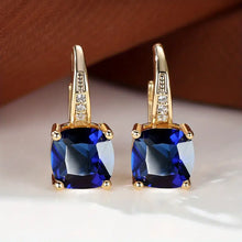Boucles d'oreilles en anneau doré avec pierre mystique