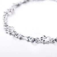 Bracelet avec Pendentifs de Patte de Chien et Os en Argent Pur