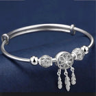Bracelet ajustable avec pendentifs en forme de trois feuilles en argent