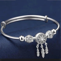 Bracelet ajustable avec pendentifs en forme de trois feuilles en argent