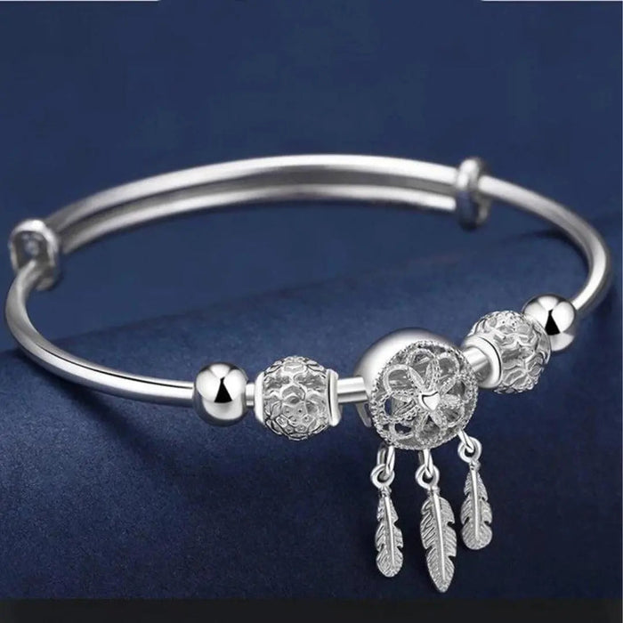 Bracelet ajustable avec pendentifs en forme de trois feuilles en argent