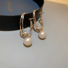 Boucles d'oreilles charmantes avec des perles