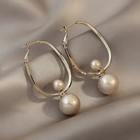 Boucles d'oreilles charmantes avec des perles