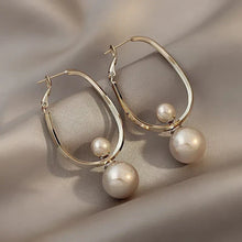 Boucles d'oreilles charmantes avec des perles