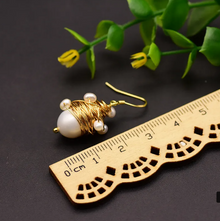 Boucles d'oreilles artisanales avec perles de riz