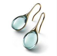Boucles d'oreilles avec opale incrustée