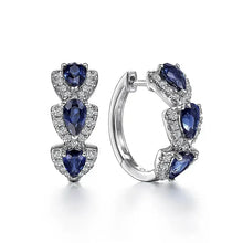 Boucles d'oreilles avec blason royal et pierres précieuses