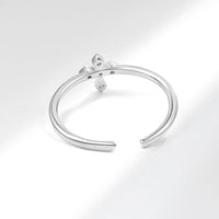 BAGUE BRILLANTE EN CROIX ARGENTÉE