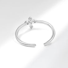 BAGUE BRILLANTE EN CROIX ARGENTÉE