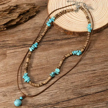 Collier de luxe pour homme avec des perles en turquoise et en œil de tigre