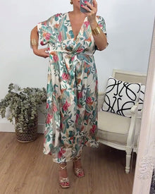 Robe élégante torsadée à col en V et imprimé botanique