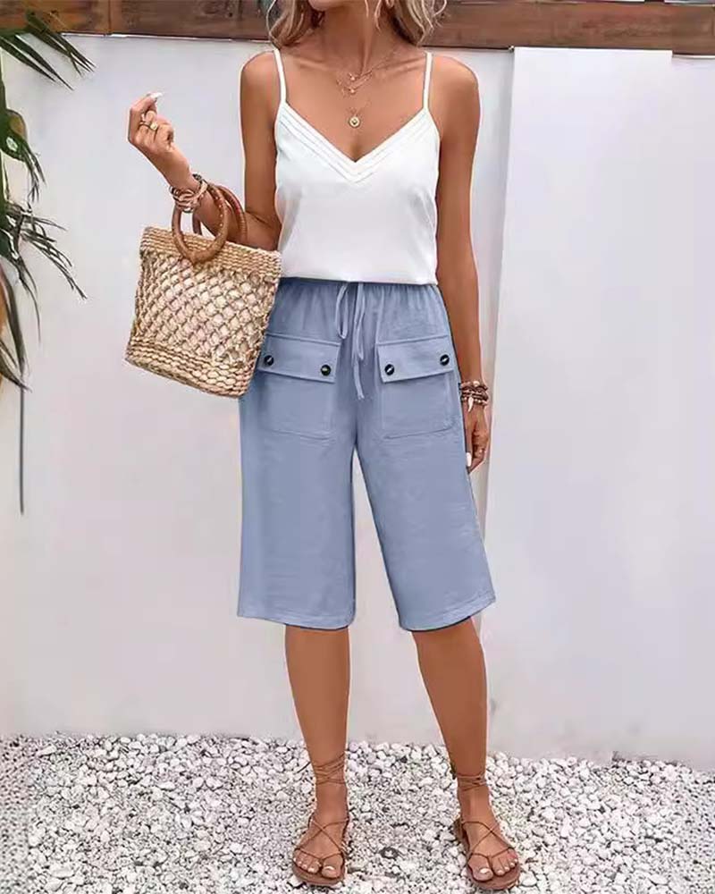 Pantalon mi-long décontracté avec poche de couleur unie