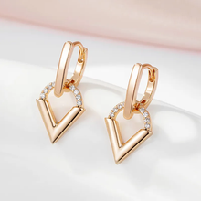 Boucles d'oreilles dorées élégantes en forme de triangle