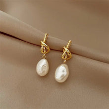 Boucles d'oreilles élégantes avec perles baroques en or
