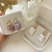 Boucles d'oreilles élégantes en or avec des perles baroques
